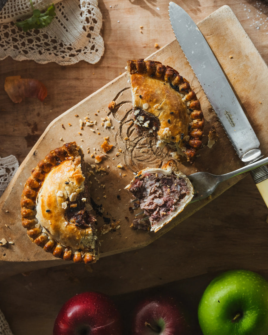 Black Pudding & Apple Pork Pie cut open showing pork and black pudding filling