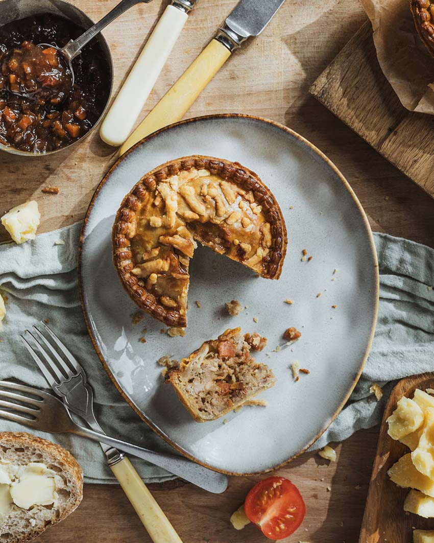 Cheese & Pickle Pork Pie cut open showing pork, cheese and pickle filling