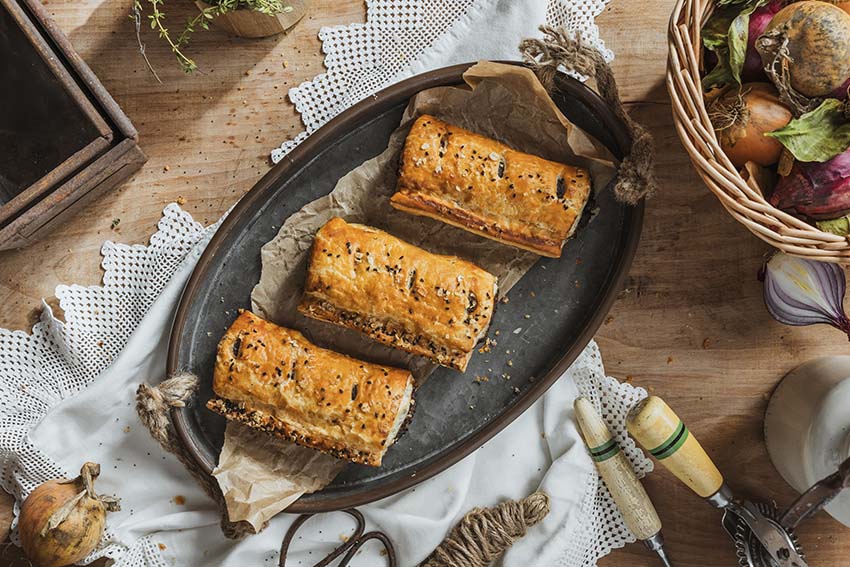 Three Pork, Black Pudding & Apple Sausage Rolls in golden flaky pastry